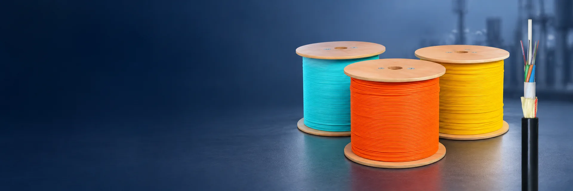 Fiber optic cabling products on a dark blue background